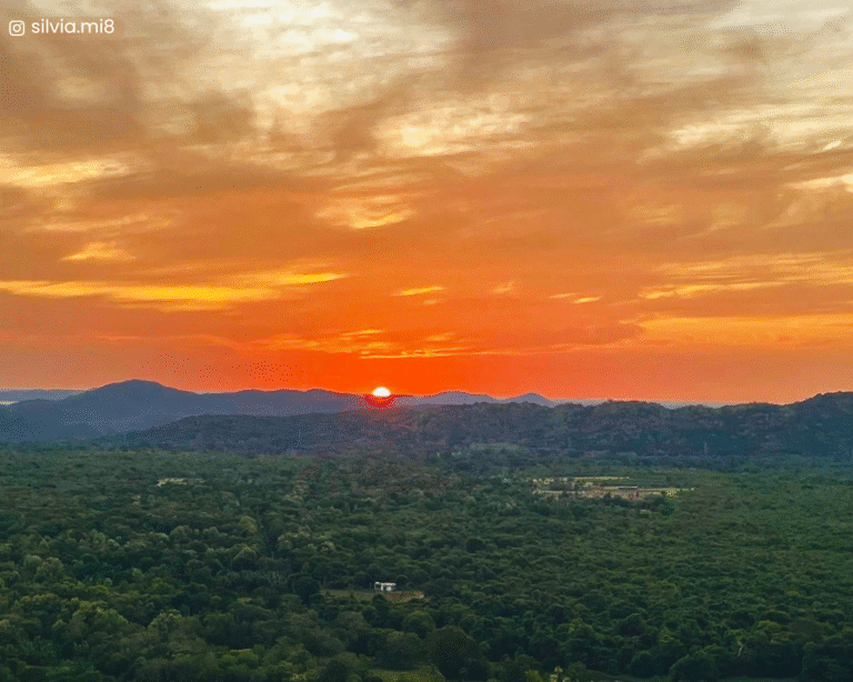 Sunset over distant plains and mountains