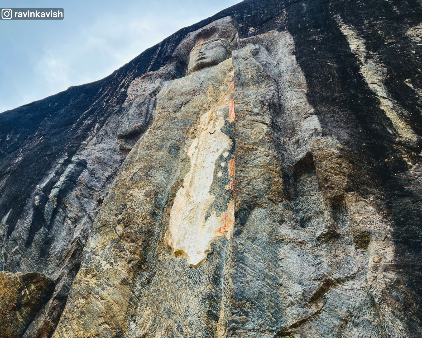 Central standing Buddha at Buduruwagala in Ella carved into the rock face showcasing Sri Lankas cultural heritage