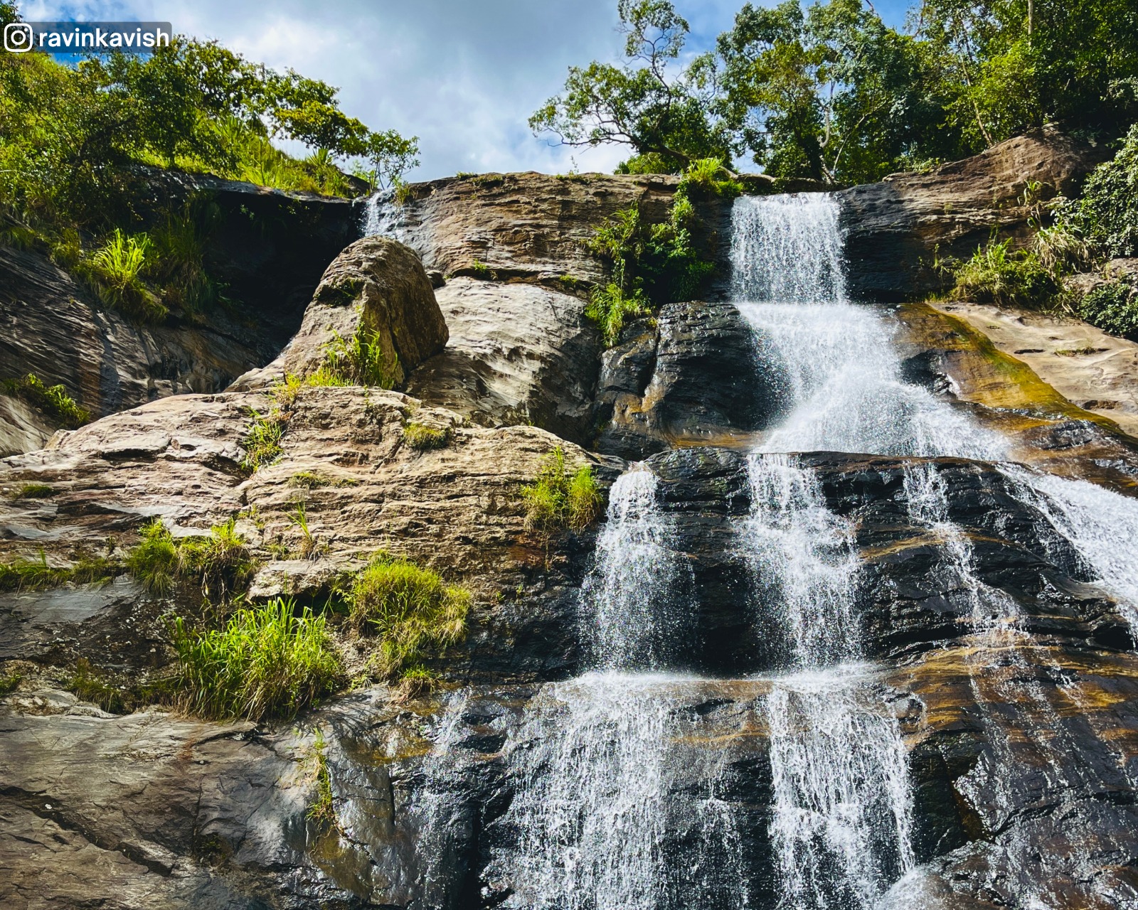 Close view of Upper Diyaluma Falls from the base, capturing the entire height of the waterfall from bottom to top in one frame