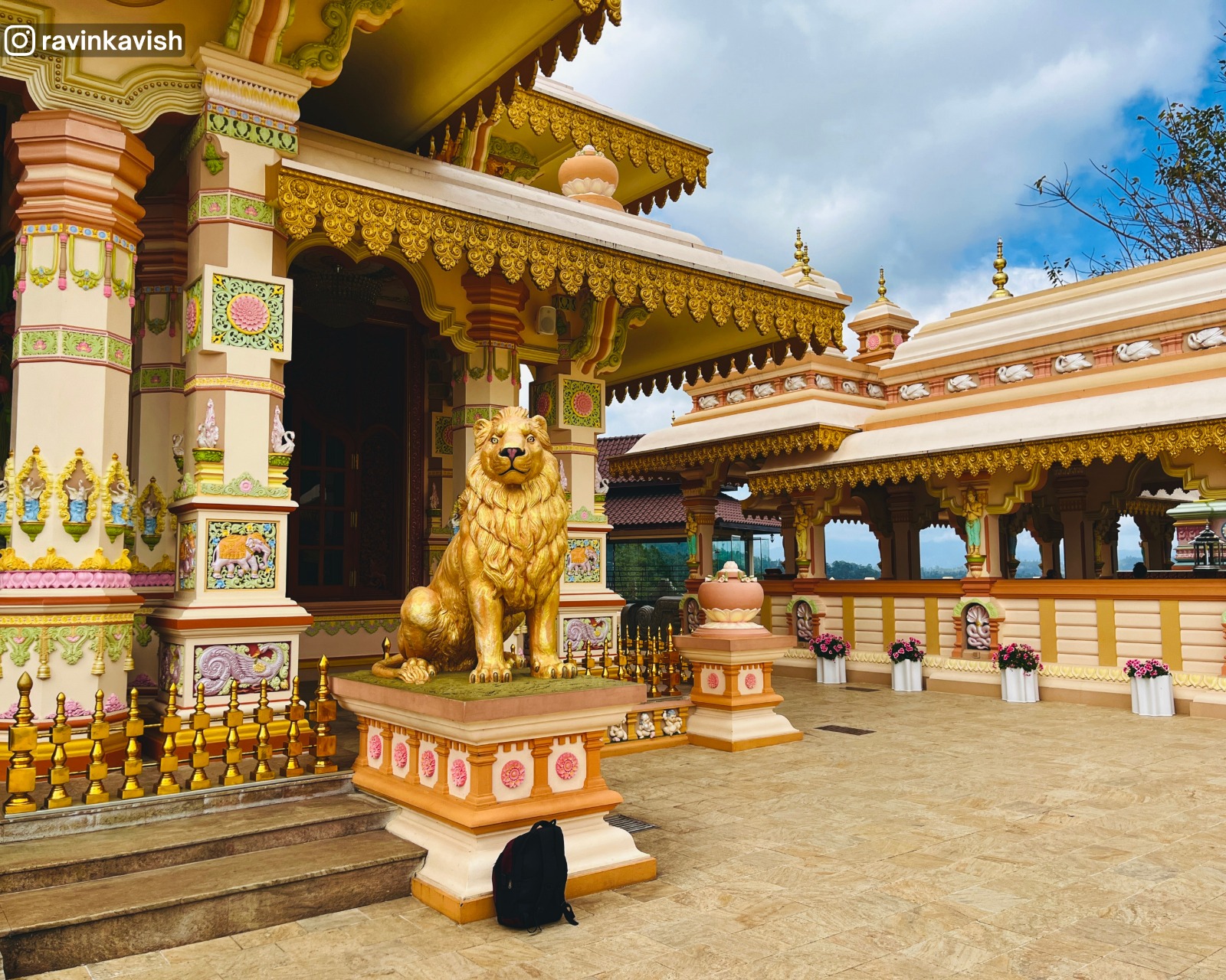 Colorful Buddhist temple structure at Mahamuwana Monastery in Ella decorated with frescoes and sculptures showcasing Sri Lankas cultural and religious heritage