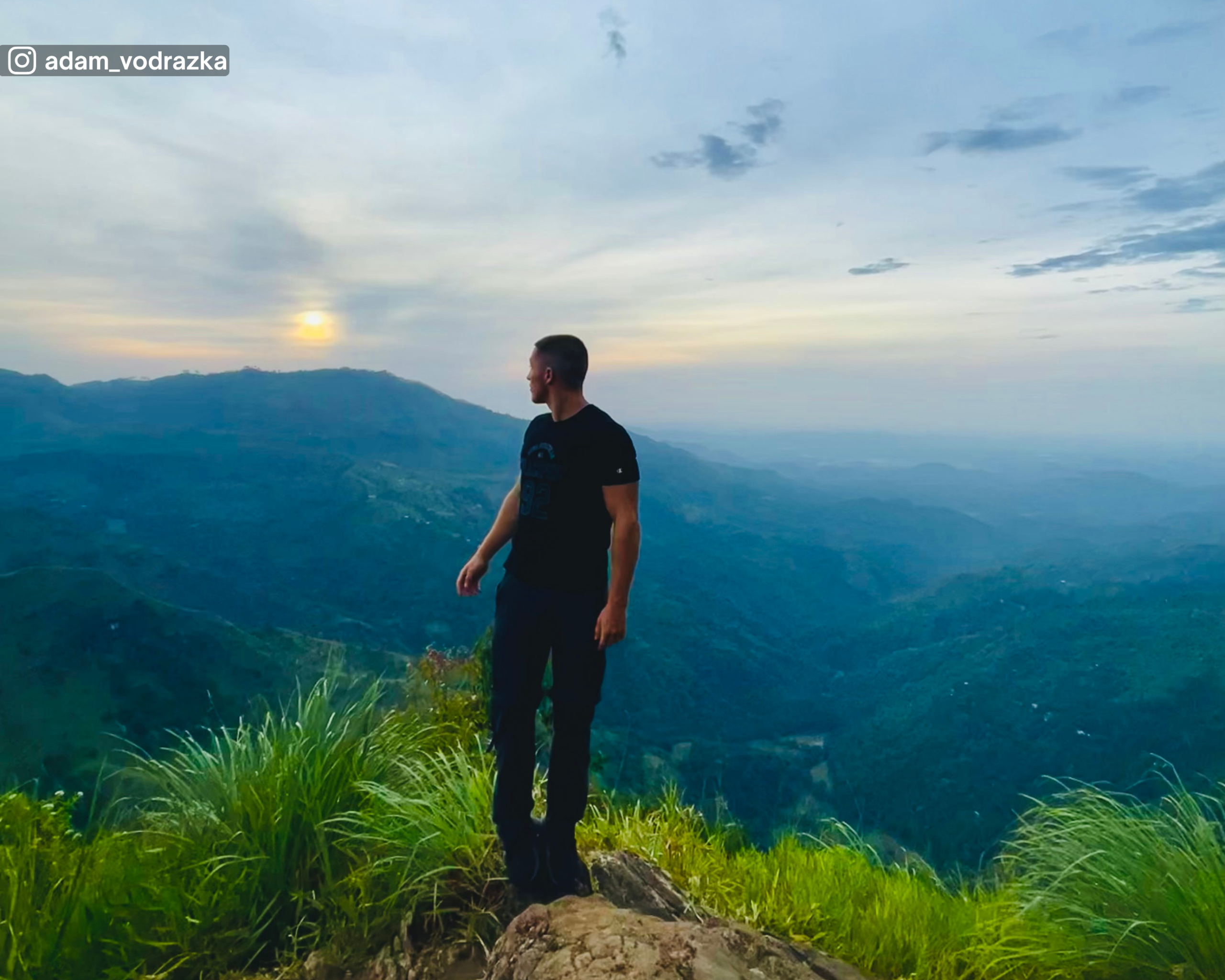 Famous photo spot at Ella Rock, showcasing distant hills and landscape views