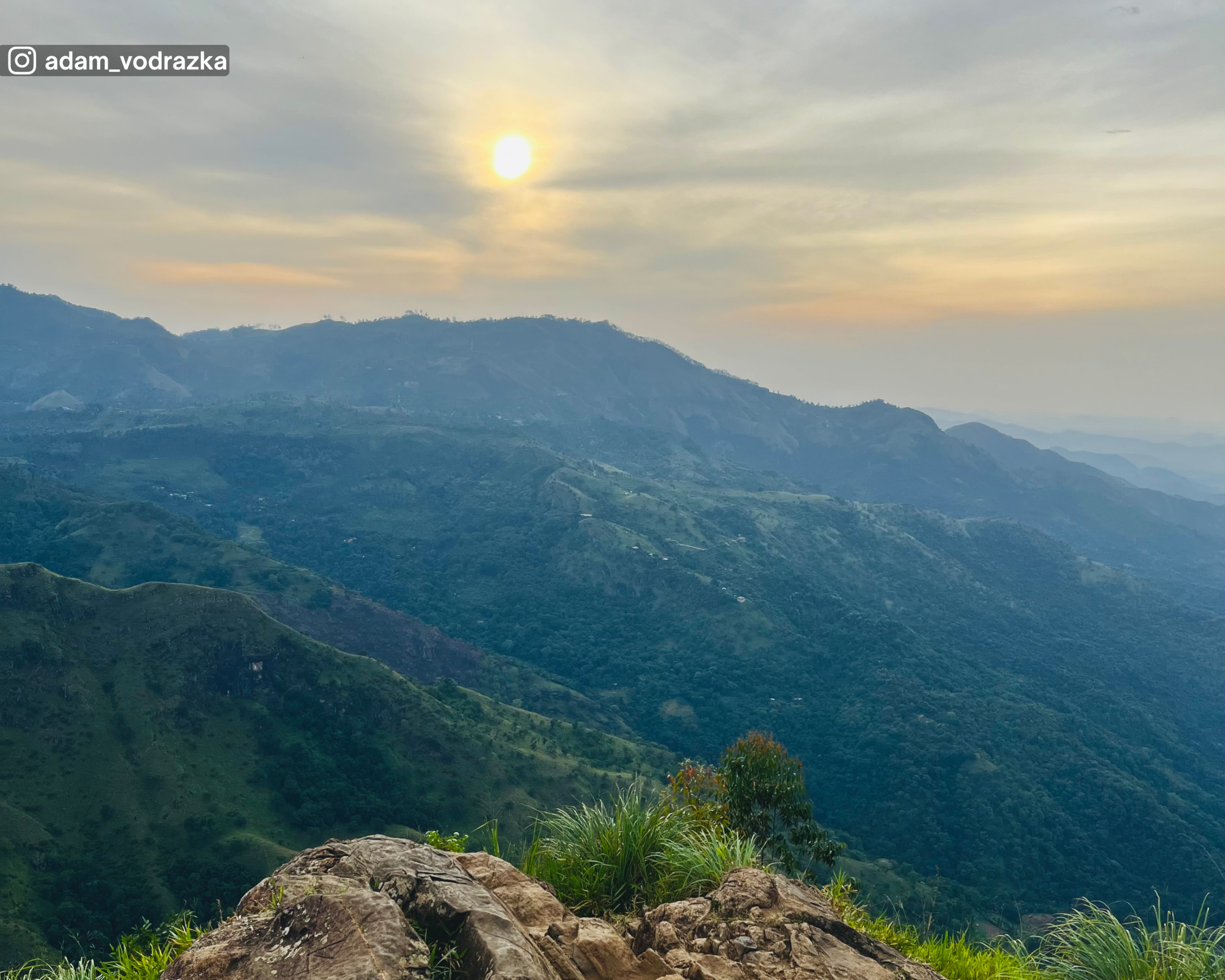 Iconic photo point at Ella Rock with distant hills and expansive views
