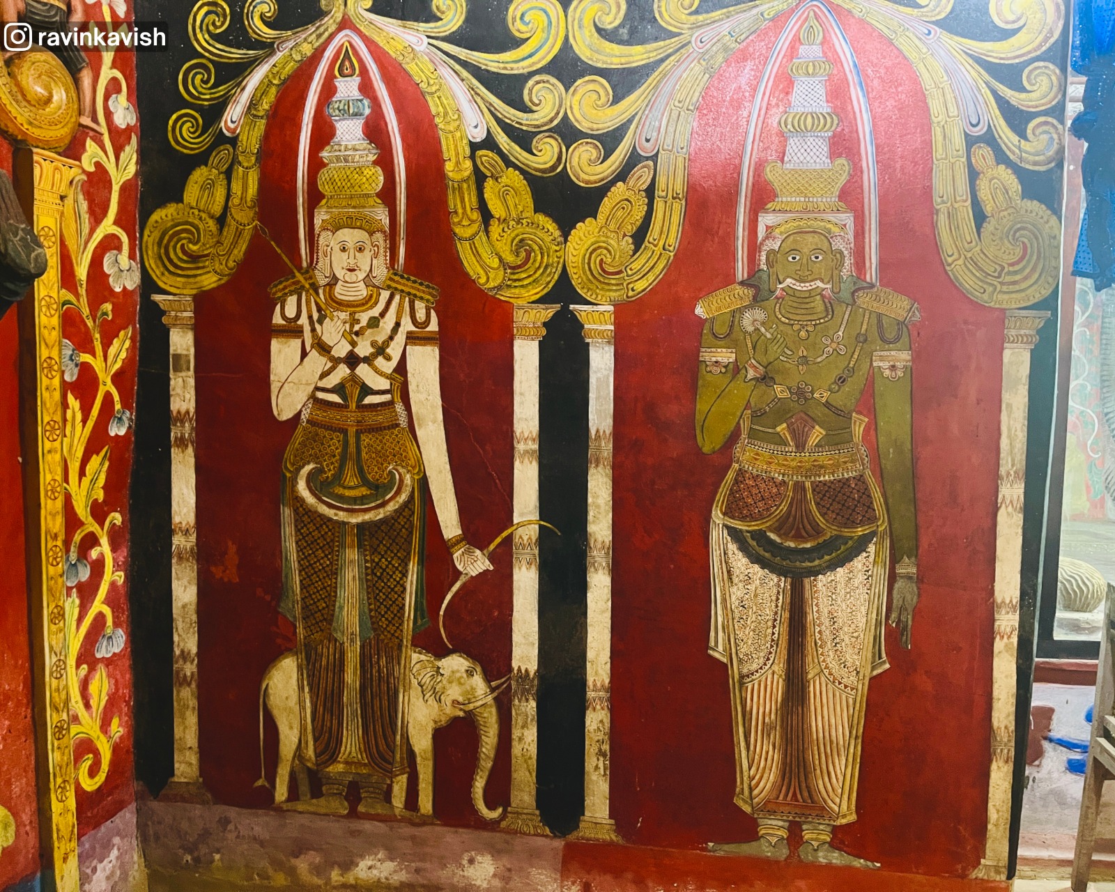 Murals of Indra holding a bow and arrow, with his elephant shown as his vehicle symbol, and the demigod Vibhishana on the right holding a talipot fan at Rakkiththa Kanda cave temple