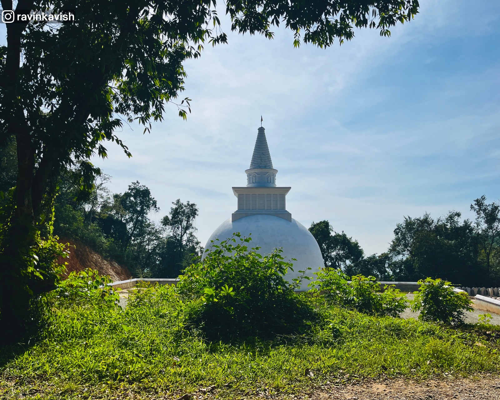 Newly built stupa at Rakkiththa Kanda Rajamaha Viharaya surrounded by greenery and natural landscape