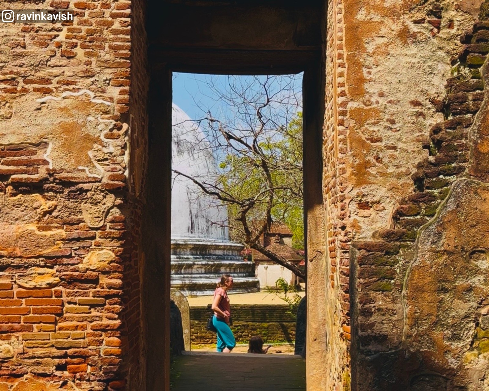 Partial view of Kiri Vehera stupa seen through an archway of Lankathilaka Temple at Alahana Pirivena, Polonnaruwa