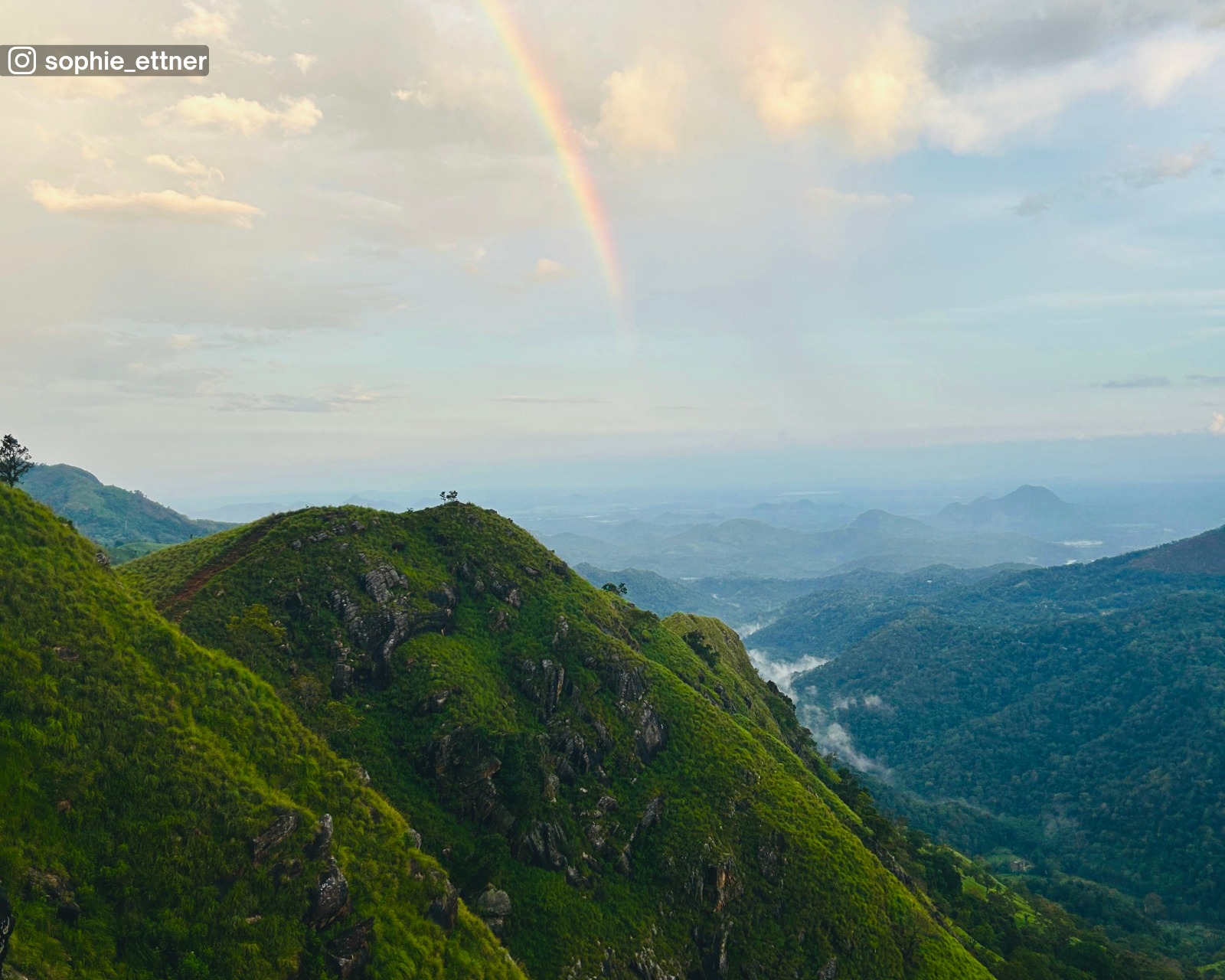 Rainbow and surrounding landscape seen from Ella Little Adam’s Peak, just after the sky cleared following rainfall