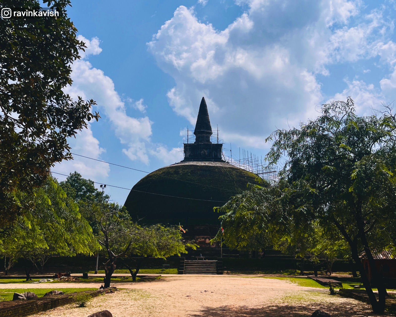 Rankoth Vehera stupa with surrounding ruins and trees at Alahana Monastery in Polonnaruwa
