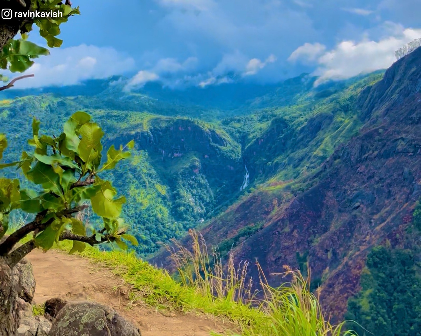 Ravana Waterfall and its mountain, seen from Little Adam’s Peak with the surrounding hills and greenery.