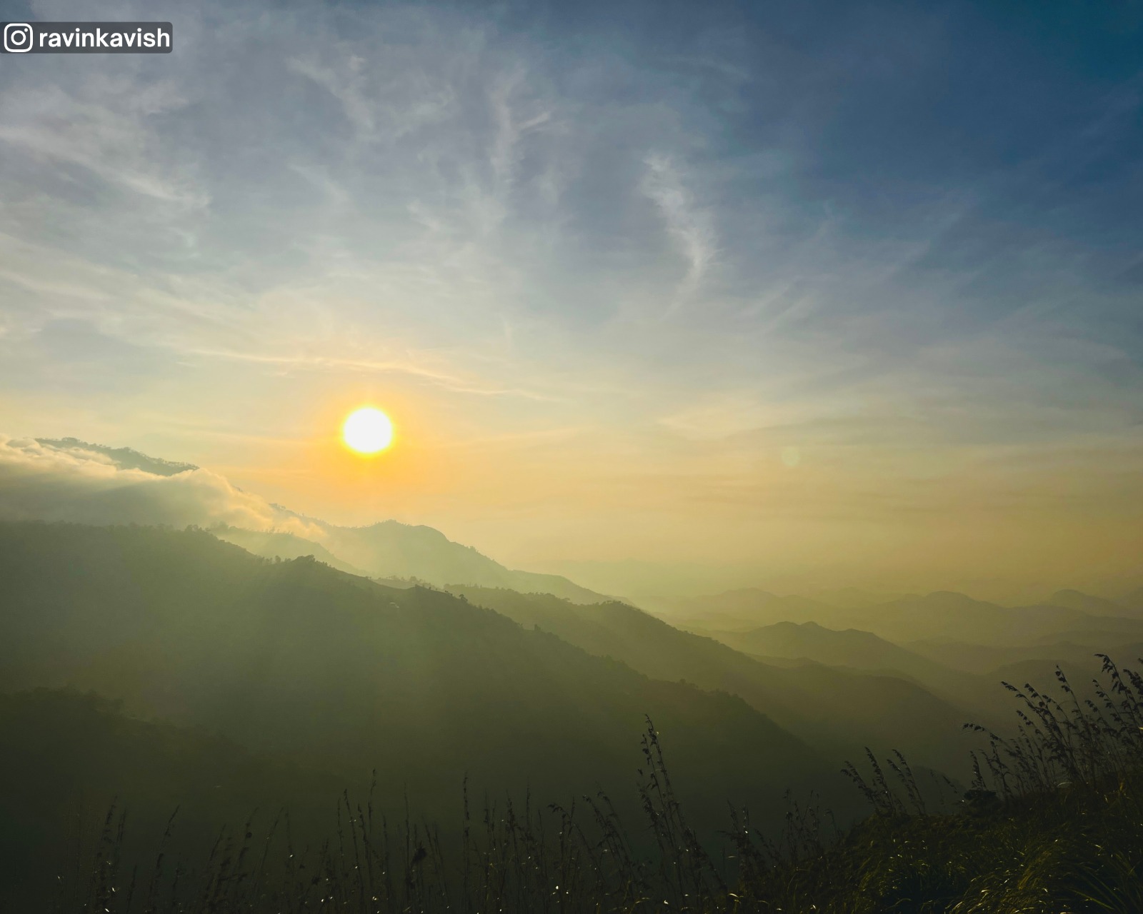 Sunrise and distant mountain views from the top of Little Adam’s Peak