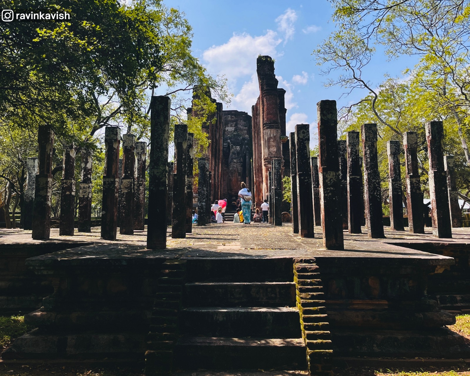 View of Lankathilaka Temple in the distance through the Hevisi Mandapaya (Drum Pavilion) at Alahana Pirivena, Polonnaruwa