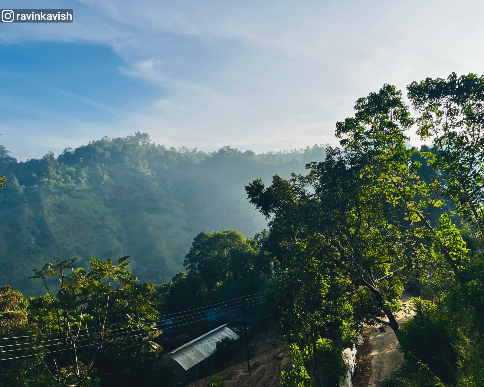 View of distant hills and valleys from Ravana Royal Cave Temple near Ella, Sri Lanka, showing forested slopes and natural terrain