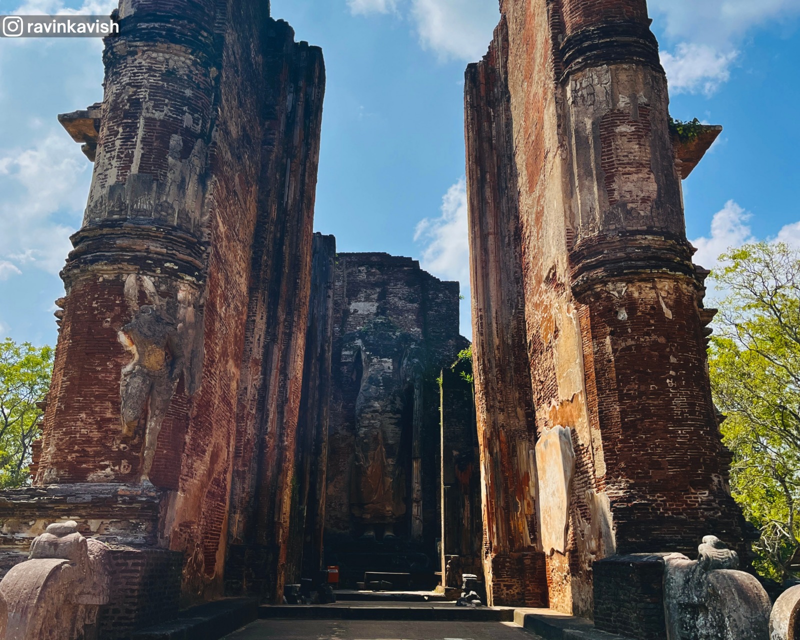 View of the iconic Lankathilaka Temple and large standing Buddha statue at Alahana Pirivena in Polonnaruwa