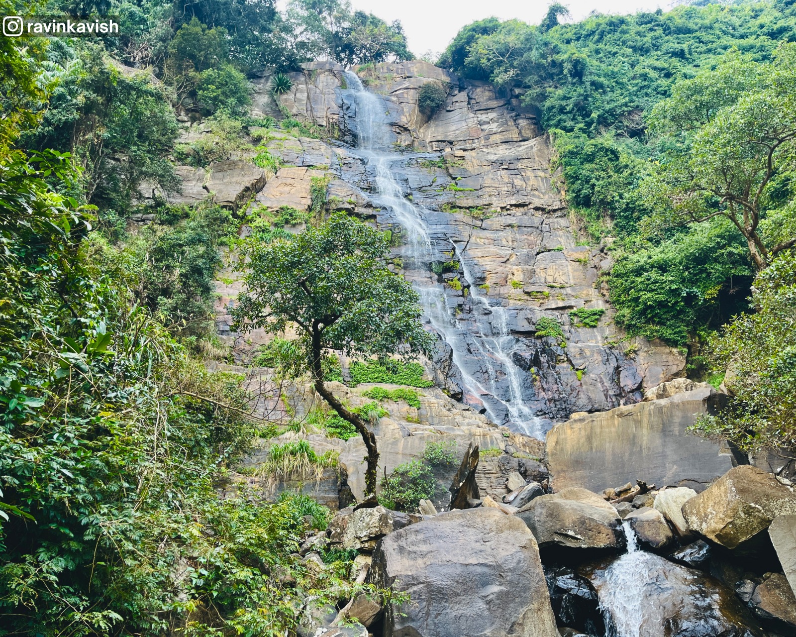 Visari Waterfall in Wellawaya near Ella with rock formations and surrounding trees showcasing Sri Lankas natural beauty
