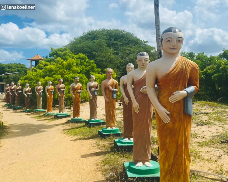 Line of monk statues in the sand at Muhudu Maha Viharaya near Pottuvil, Sri Lanka