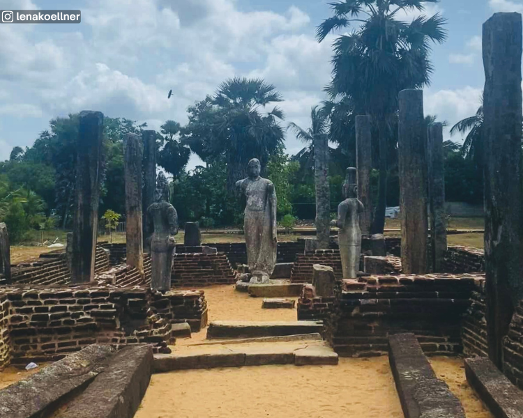 Ancient image house with three statues, low brick walls and stone pillars at Muhudu Maha Viharaya near Pottuvil, Sri Lanka