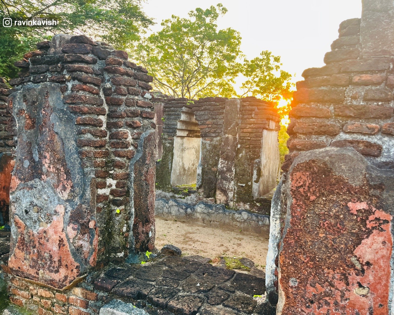 Sunset view through Brick walls of Baddha Sima Prasadaya (sacred boundary hall) ruins in Alahana Pirivena, Polonnaruwa