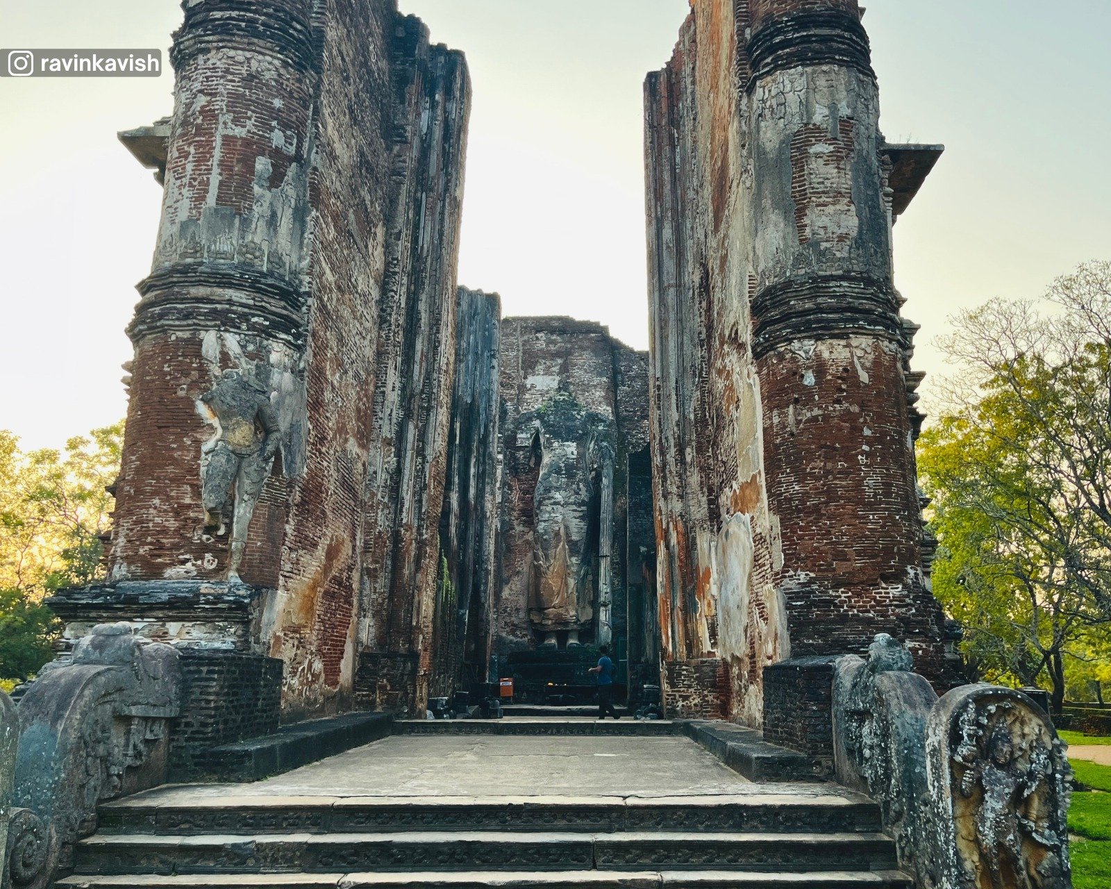 View of the iconic Lankathilaka Temple and large standing Buddha statue at Alahana Pirivena in Polonnaruwa