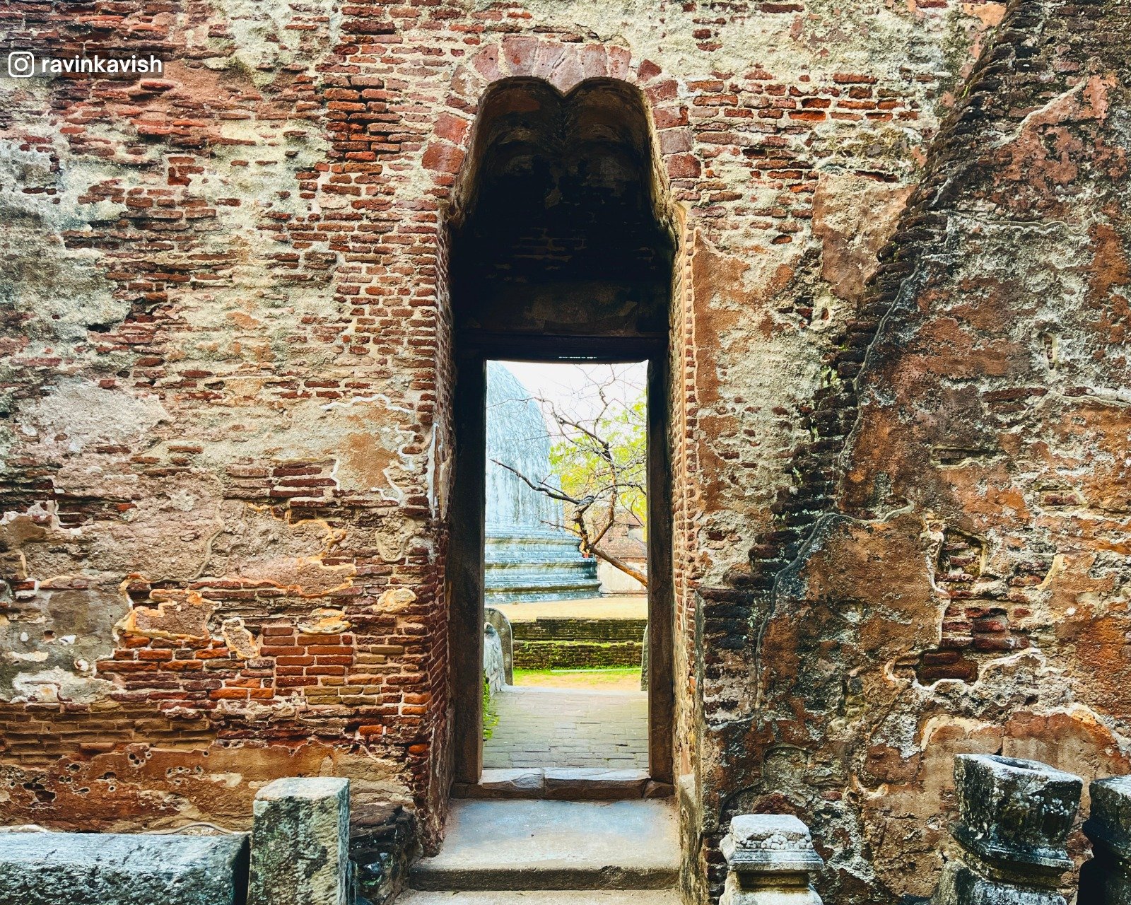 Partial view of Kiri Vehera stupa seen through an archway of Lankathilaka Temple at Alahana Pirivena, Polonnaruwa