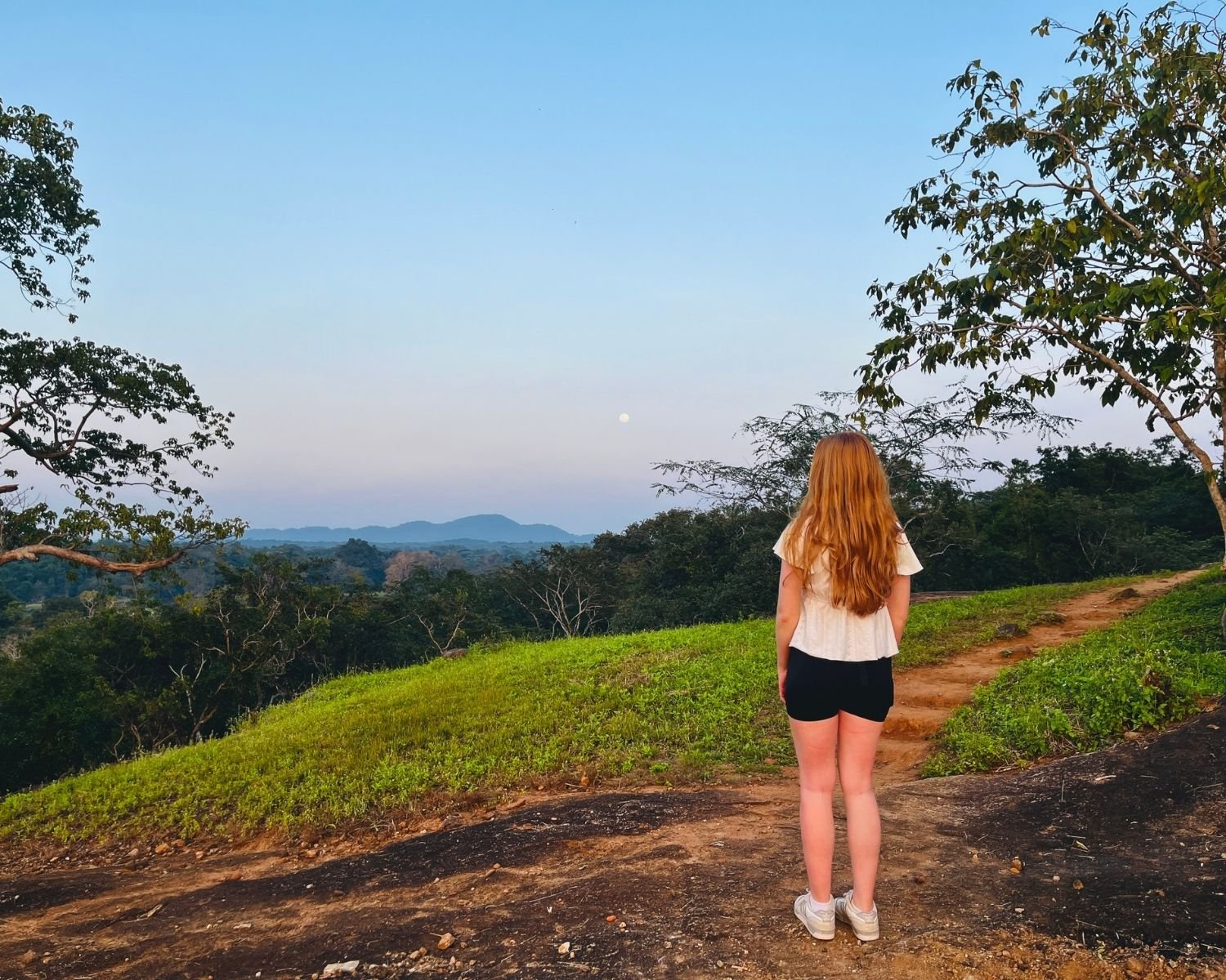 Evening moonrise view from mid-tier trail at Mapagala Fortress Little Pidurangala looking toward distant hills Sri Lanka