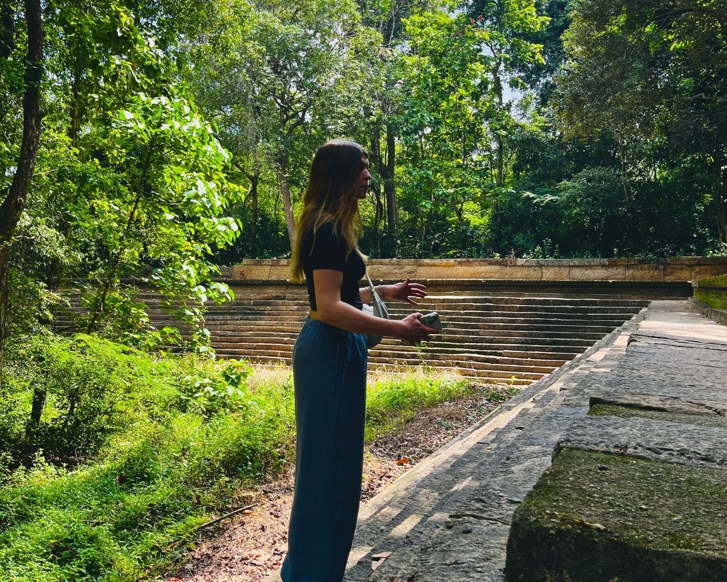 Stone-lined Banda Pokuna bathing pond with steps and pillars at Ritigala Forest Reserve and Archaeological Site near Habarana, Sigiriya, Sri Lanka