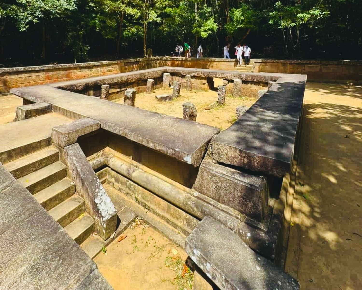 Front view of twin stone meditation platforms with pillars surrounded by jungle at Ritigala Forest Reserve and Archaeological Site near Habarana, Sigiriya, Sri Lanka
