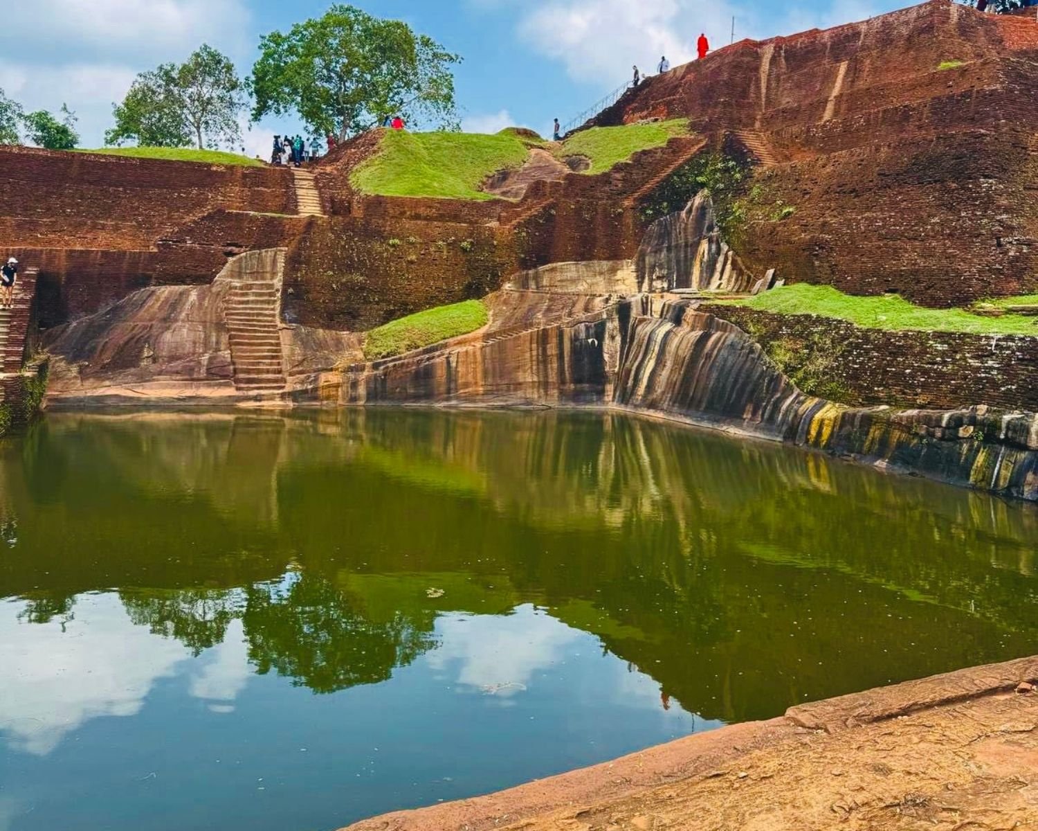 Sigiriya Rock main summit pool ancient cistern with rock steps Sri Lanka