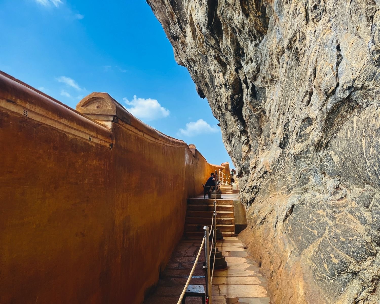 Sigiriya Rock Mirror Wall pathway beside cliff face Sri Lanka