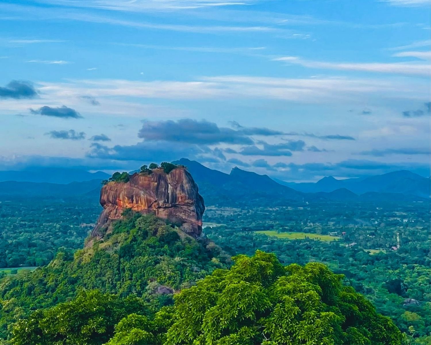 Sigiriya Rock full view from Pidurangala Rock at golden hour Sri Lanka