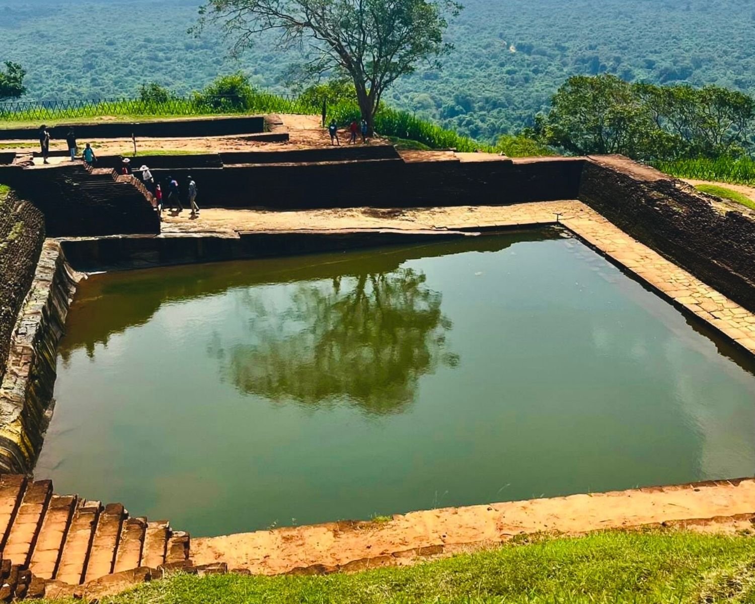 Sigiriya Rock summit pool ancient royal cistern jungle view Sri Lanka