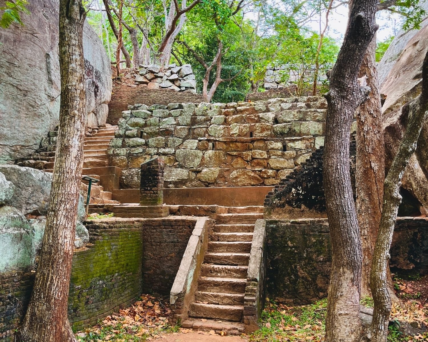 Sigiriya Rock Terrace Gardens ancient stone steps and walls Sri Lanka