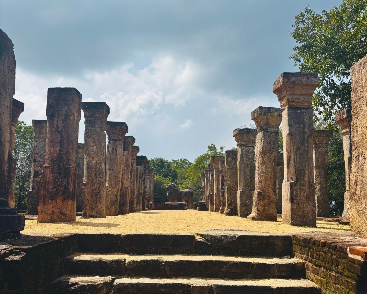 Council Chamber of Nissanka Malla showing entrance steps, stone columns, and lion statue