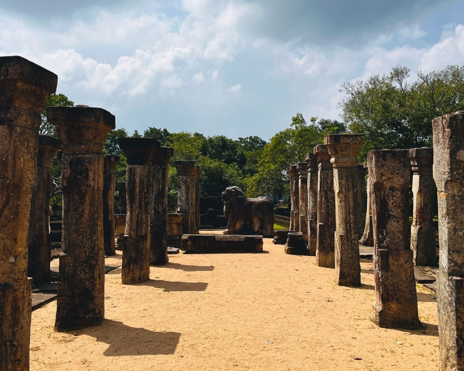 Council Chamber of Nissanka Malla showing rows of stone pillars leading toward carved lion statue