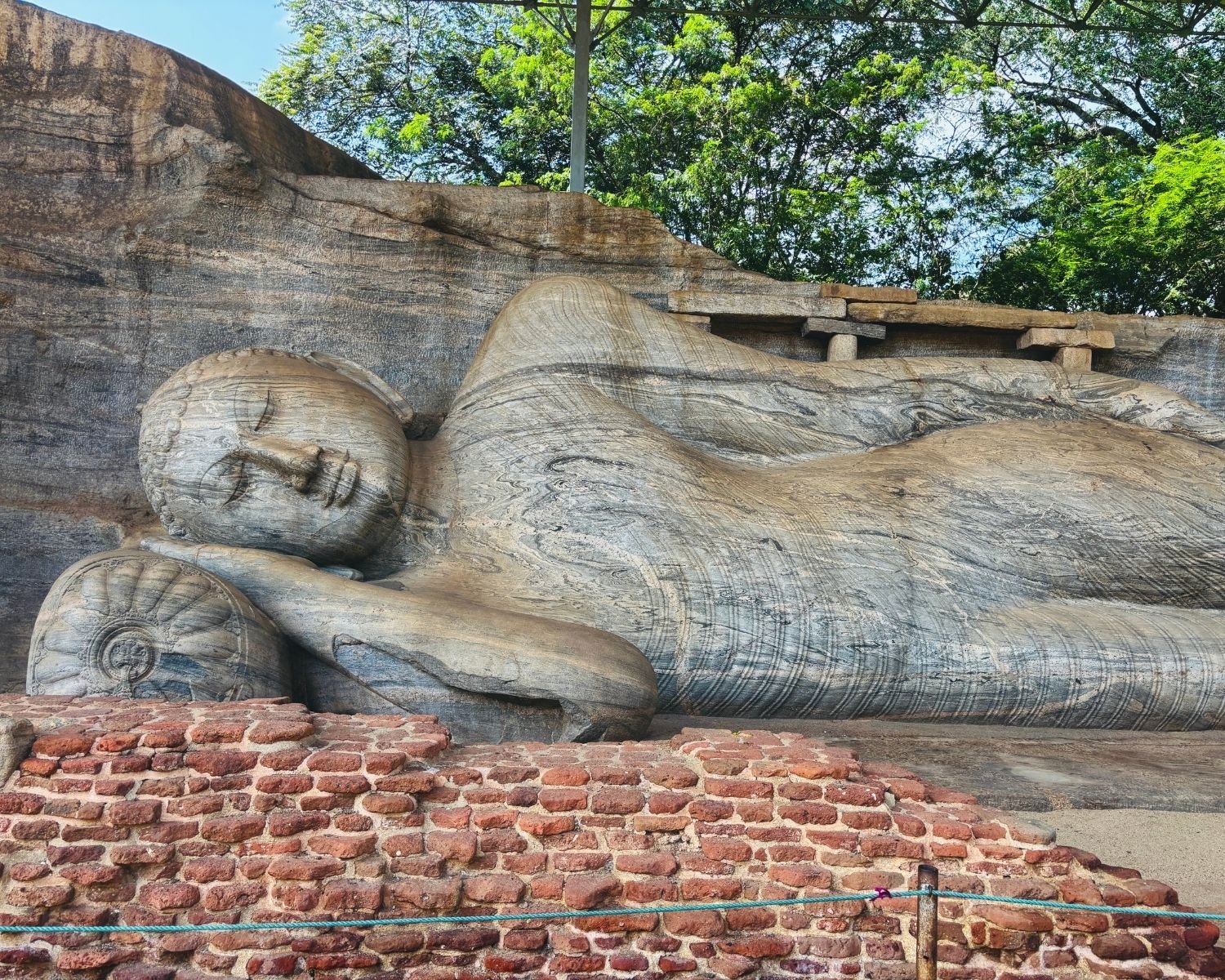 Close view of reclining Parinirvana Buddha carved in granite at Gal Vihara Uttararama