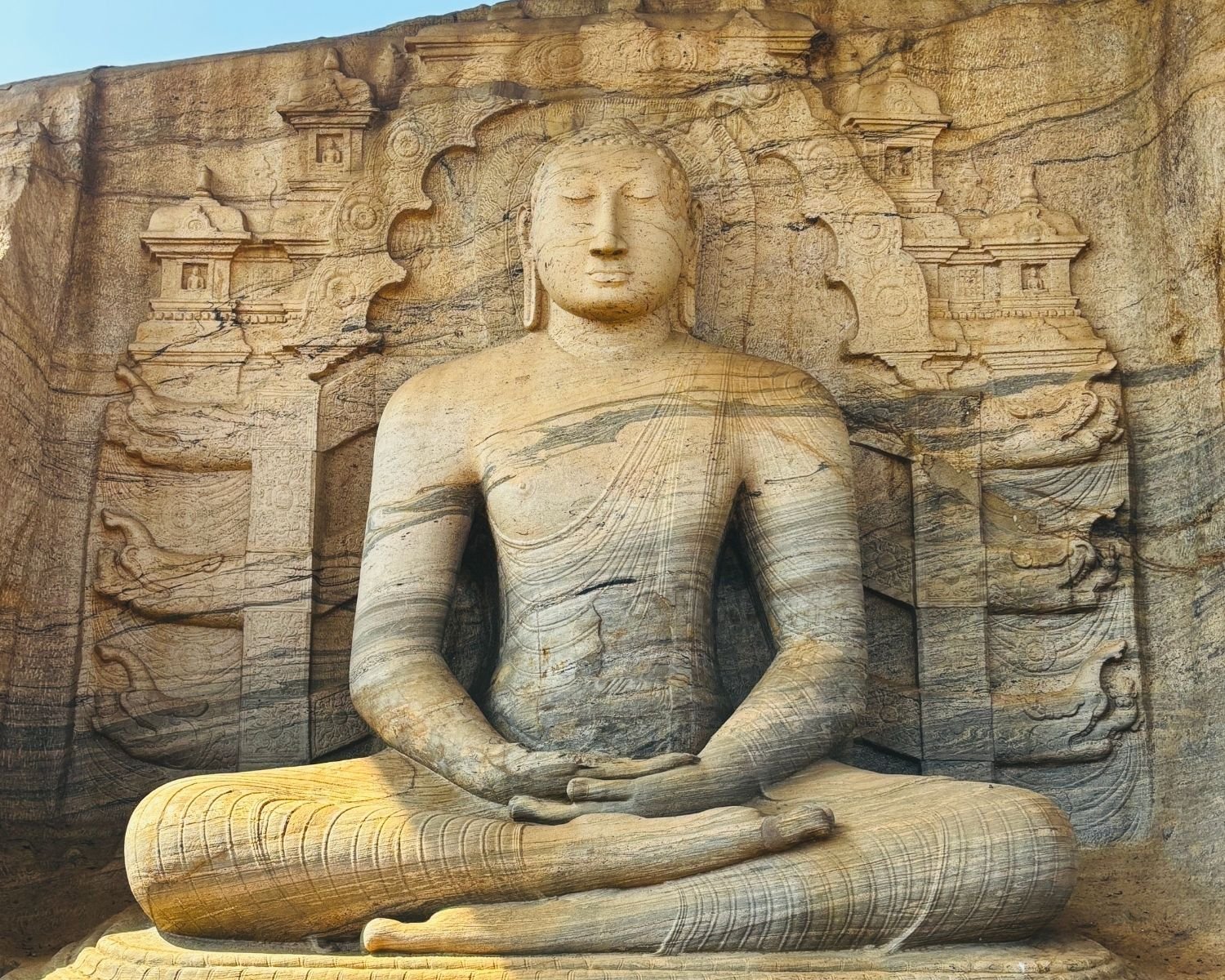 Seated Buddha in Dhyana Mudra with carved throne at Gal Vihara Uttararama