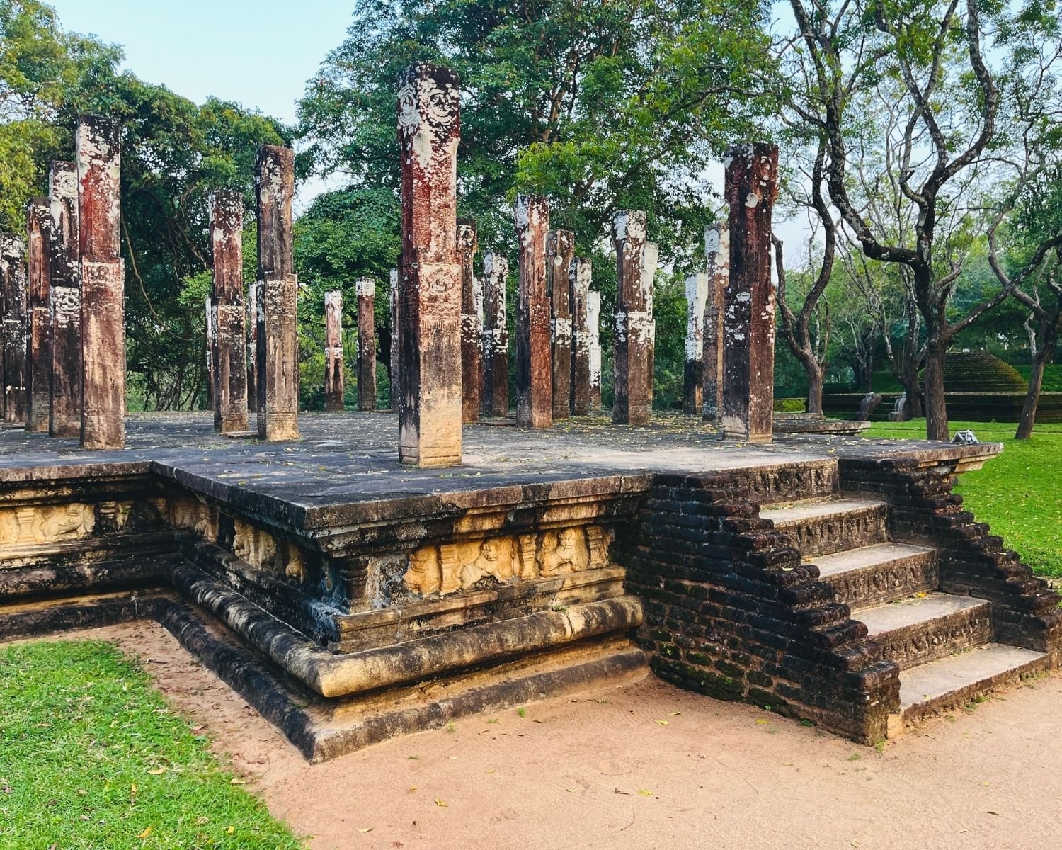 Carved stone pillars and steps of Hevisi Mandapaya Drum Pavilion in Alahana Pirivena