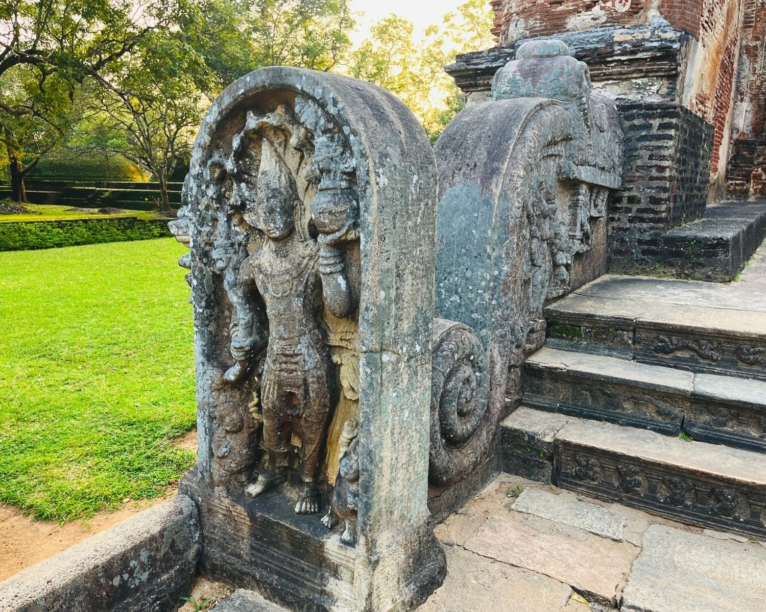 Carved stone guardstone and balustrade at the entrance steps of Lankatilaka Image House