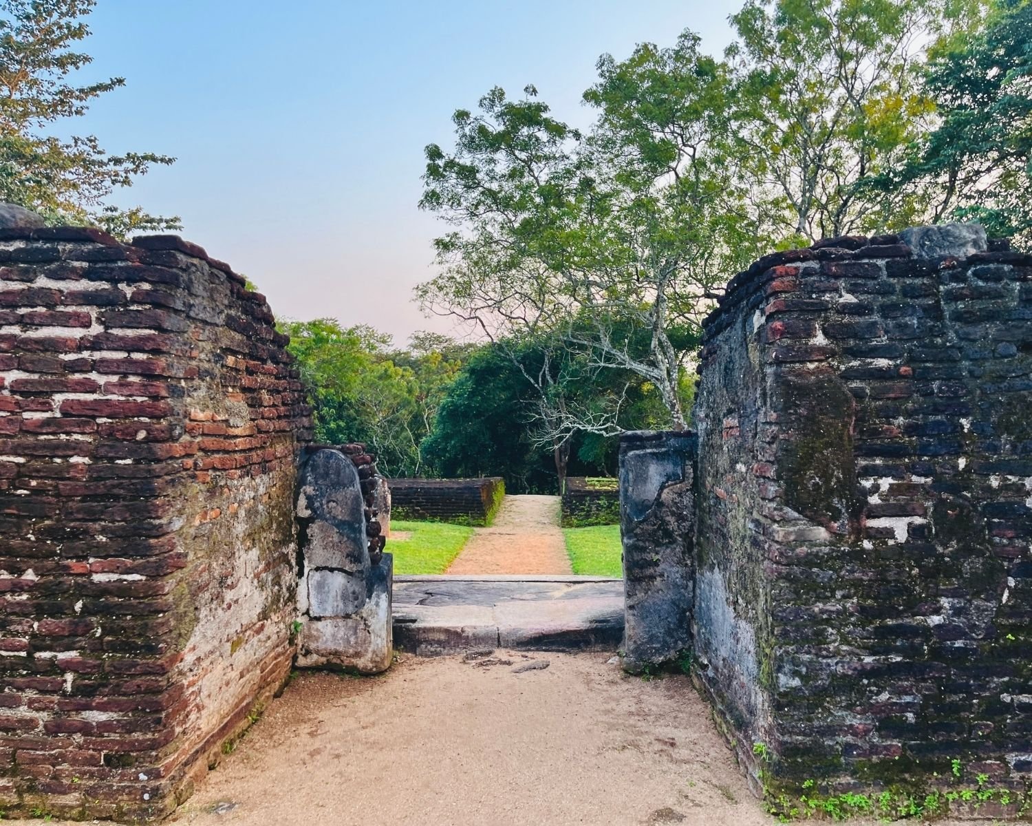 View from inside Baddhasima Prasadaya looking out south entrance through brick walls