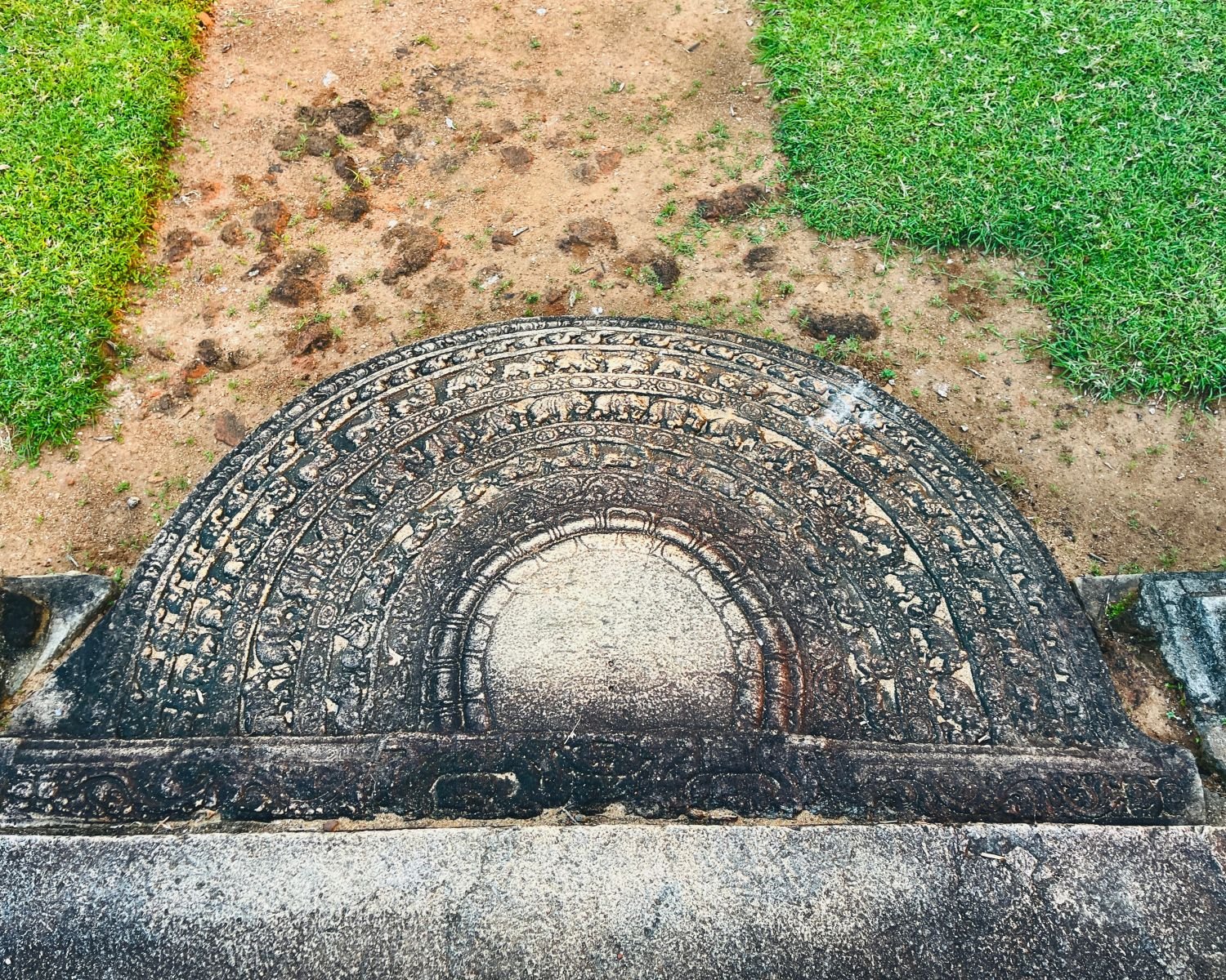 Carved sandakada pahana moonstone at south entrance of Baddhasima Prasadaya with stone steps