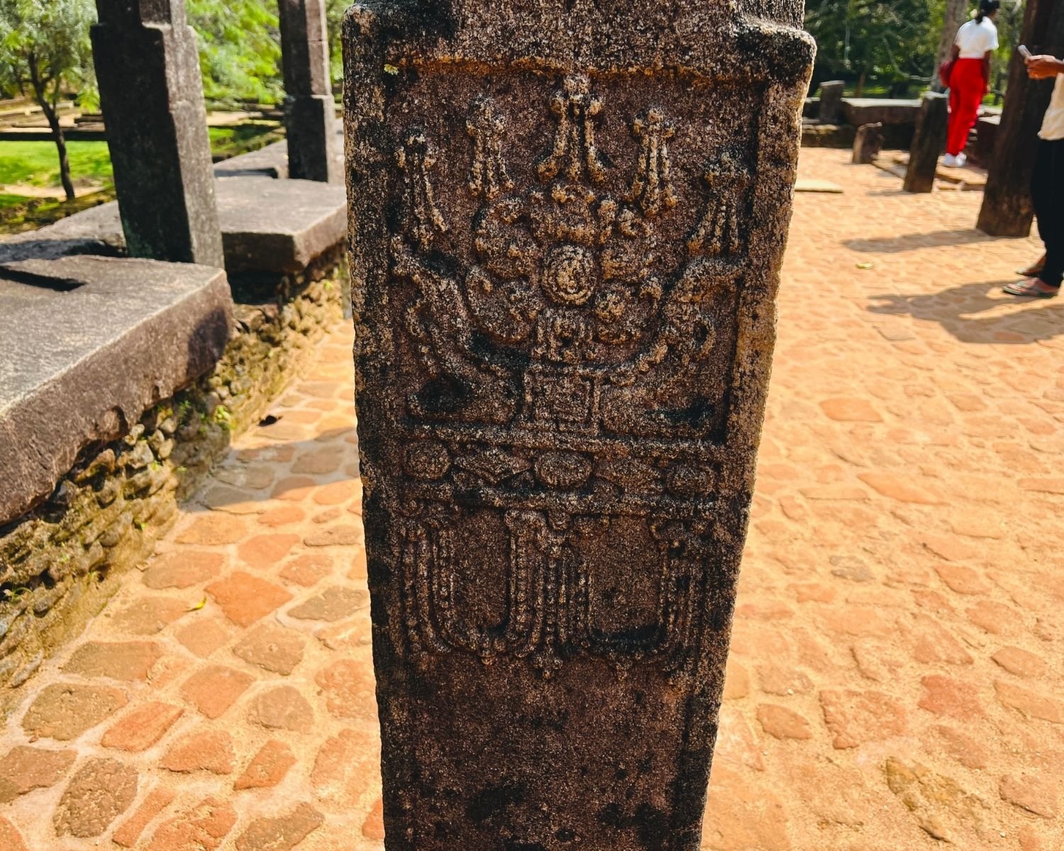 Close-up of carved stone pillar at Council Chamber showing ornamental floral and ceremonial motifs