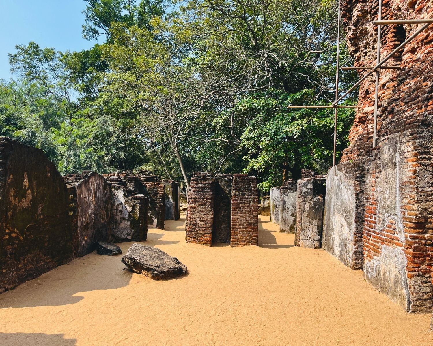 Interior room remains inside Royal Palace showing brick partitions and plastered wall fragments