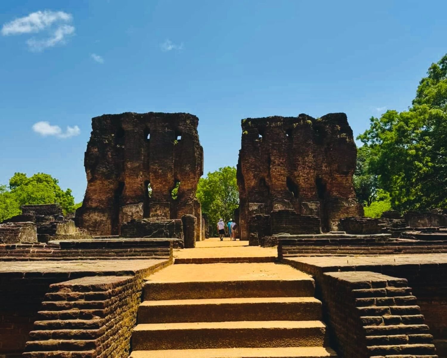 Main entrance of Royal Palace with steps leading toward surviving massive brick walls