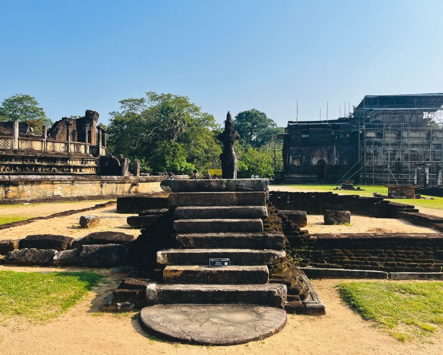 Stone steps and moonstone leading to Bodhisattva statue platform with Vatadage left and Thuparama right