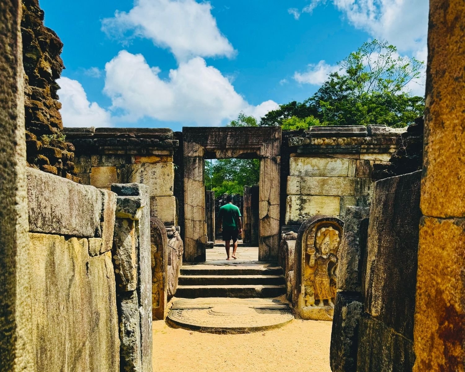 Second stone doorway inside Hatadage with moonstone, guard stones, and carved steps