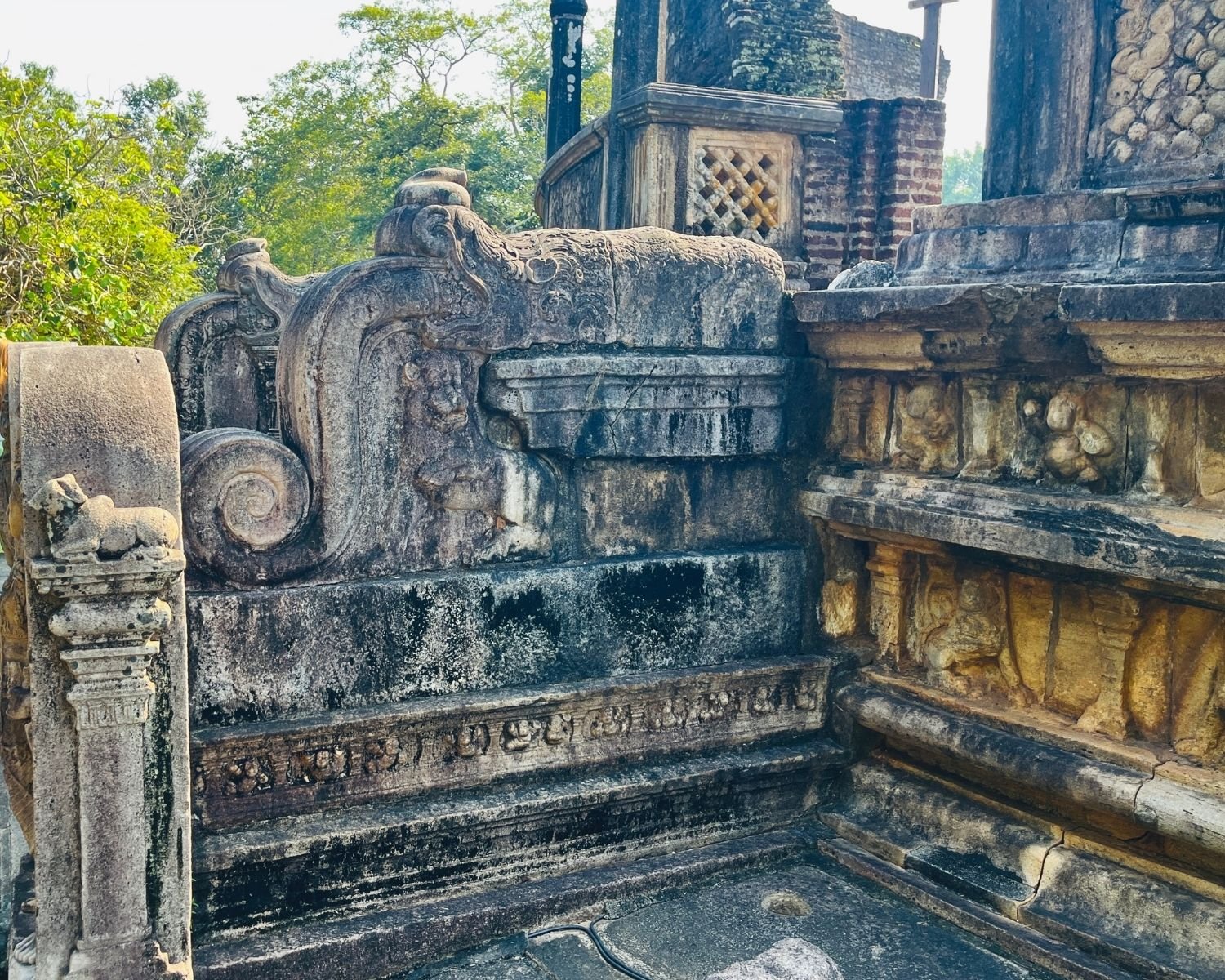 Vatadage korawak gala balustrade with dwarf figures, lotus motifs, and stone steps to platform