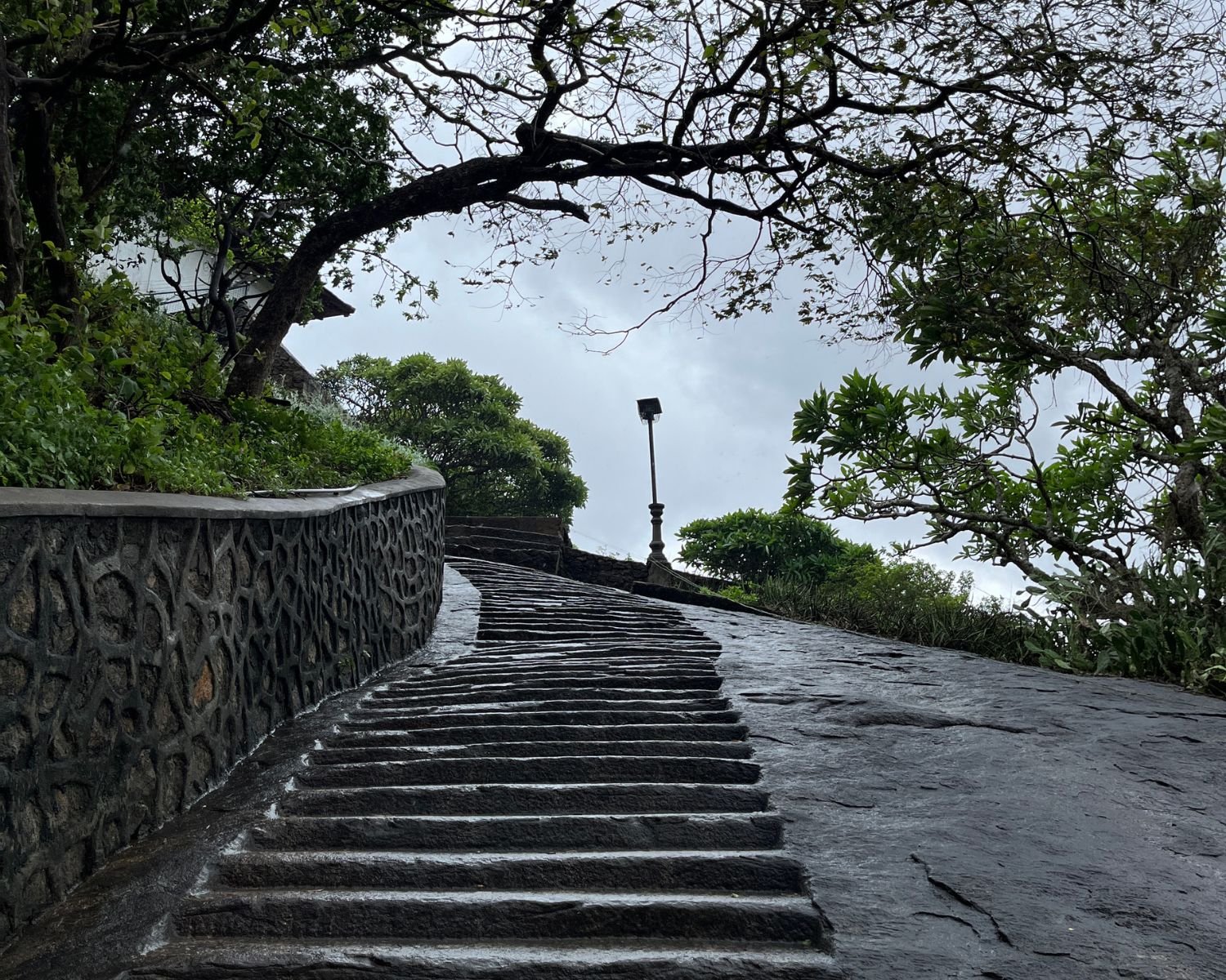 Stone pathway leading uphill toward the cave shrine area