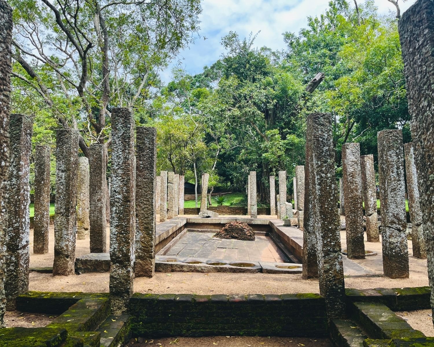 Sunken stone bathing pool with basins surrounded by pillars inside the Herbal Bath House, also known as Jantaghara, at Abhayagiri monastery in Anuradhapura