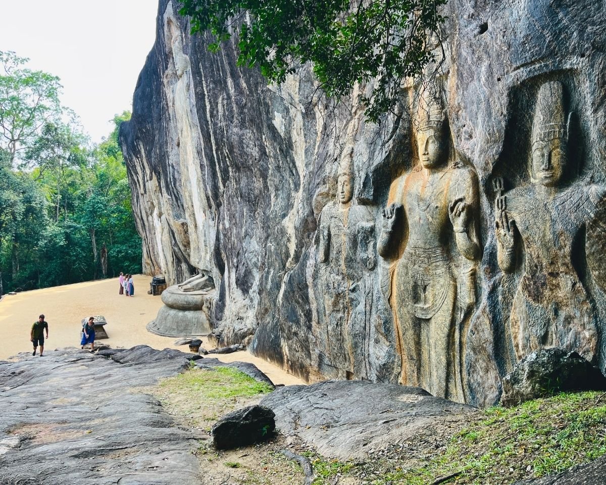Maitreya Bodhisattva and attendant figures carved into the Buduruwagala cliff