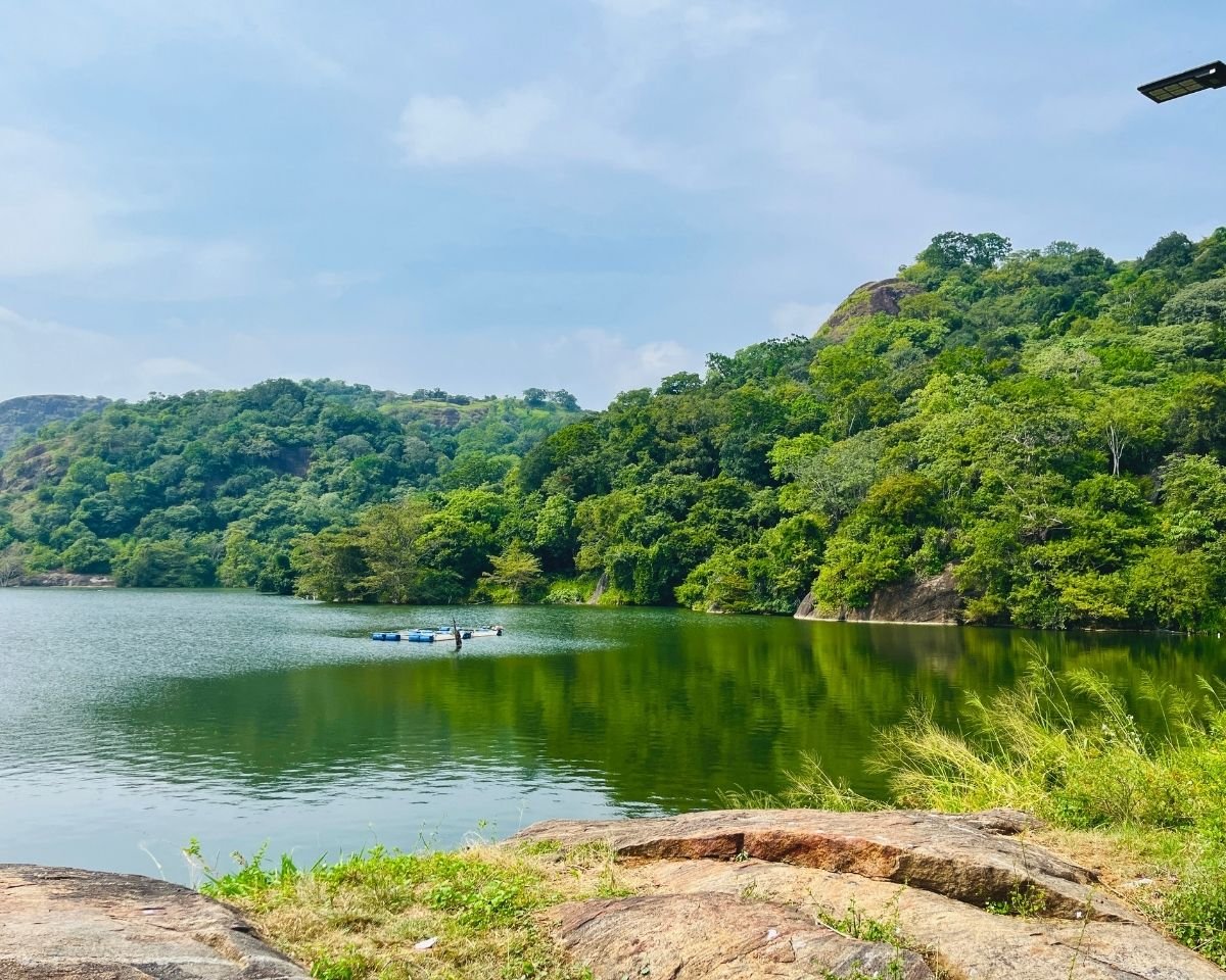 Rocky shoreline overlooking the waters of Buduruwagala Reservoir