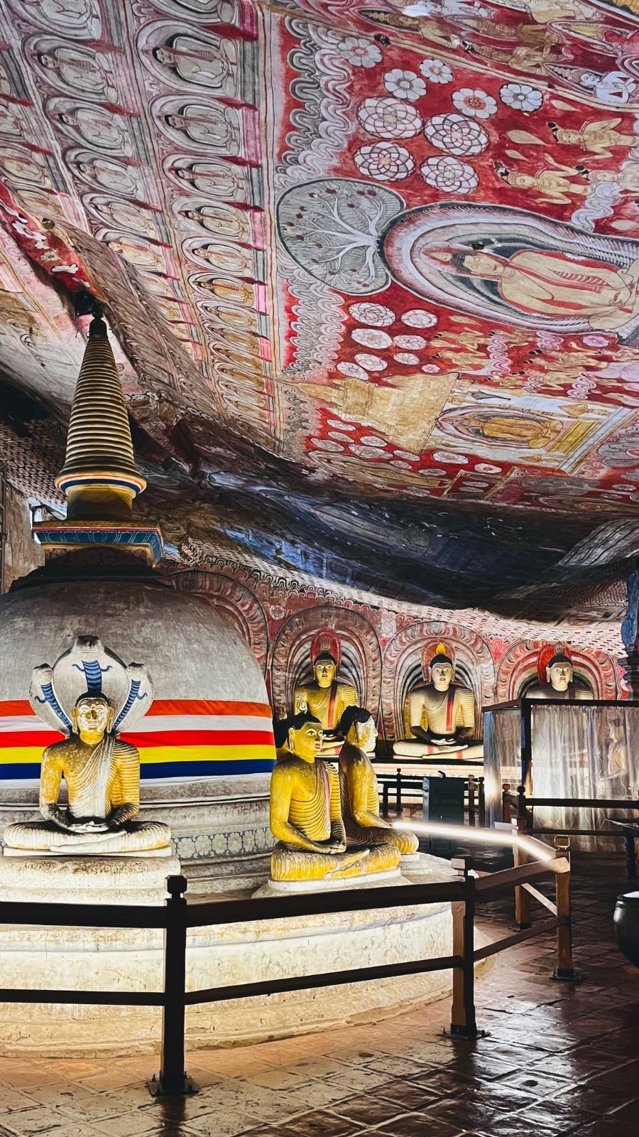 Maharaja Viharaya, Cave 2 of Dambulla Royal Cave Temple in Sri Lanka, showing a sacred stupa encircled by seated Buddha statues