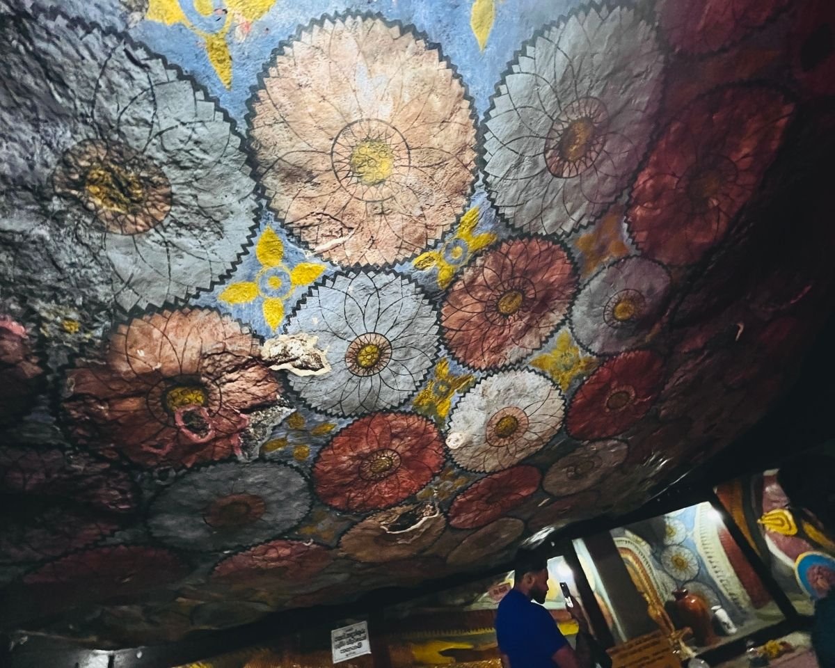 Traditional lotus and floral paintings on the cave ceiling